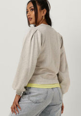 Zipped neck puffed sleeved sweater